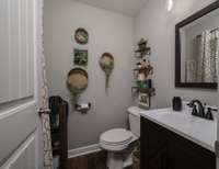 Powder room with window for natural light and air.
