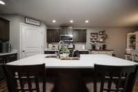 Gorgeous island provides yet more storage and a place to visit with the cook.