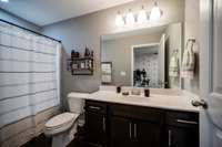 Upstairs bathroom shared by the two bedrooms. A full tub and combo shower.
