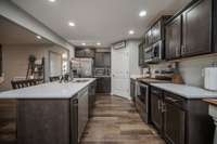 You can see extra cabinets tucked between the refrigerator and the corner walk-in pantry.