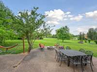 The large patio has plenty of space for dining and lounging.