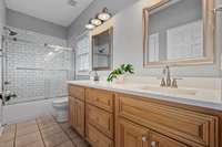 Renovated bathroom with double vanity.