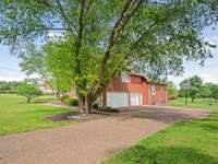 A 3 car garage offers space for parking and storage.