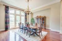 The formal dining room has doors to the front terrace. Imagine summer suppers with the doors open and the dining room full of guests.
