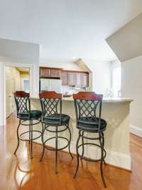This kitchen bar is large enough to host three barstool chairs with ease.