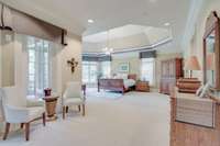 The primary retreat encompasses the entire northern wing of the home & includes a sitting room, mirrored gym, “yours and mine” dream closets and bathroom with separate vanities and separate water closets, glass shower & a deep, jetted soaking tub.