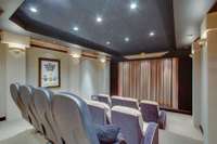 The home theater also serves as a tornado shelter/safe room. Built at an additional cost of 500 thousand dollars, the floors, walls & ceiling are solid concrete FEMA graded, providing you with a perfect space for safety and sound proof movie nights.
