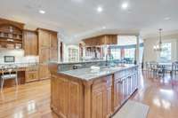 Expert utilization of cabinetry prevents wasted space from the central island, to the desk area, to the bar by the Billiards Room.
