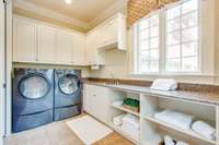 If you must do laundry, do it in a place like this!  This is one of three laundry options within this home.