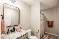 Large full bath downstairs with tile floor!