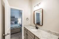 Primary bath has double vanity and granite countertop~