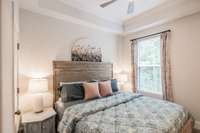 Primary bedroom has tray ceilings~