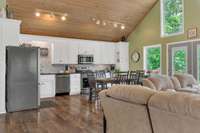 Chef's kitchen with designer touches and stainless appliances, granite counters and tile backsplash