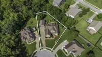 Fantastic cul-de-sac location with partial privacy fence and trees providing privacy around the home.