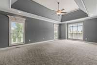 Another view of the primary bedroom,