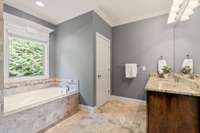 Primary bathroom with separate vanities