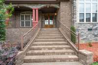 The grand staircase leading into the home is perfect for seasonal displays and leads to a nice sized covered front porch.
