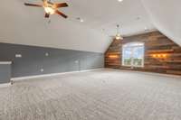 The huge bonus room is wired for surround sound and located above the garage.