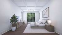 Primary Bedroom on Main Level with few of rear yard tree line.