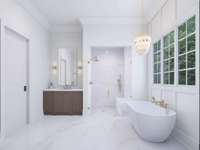 Primary Bath connects to two large walk in closets and Laundry Room.