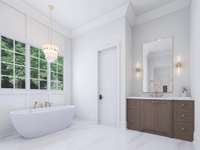 Primary Bath connects to two large walk in closets and Laundry Room.
