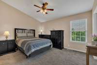 The secondary bedroom also has a vaulted ceiling and private bath.
