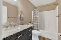 Primary Bath has a beautiful vanity with ample counter space.