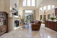 The living room looking into he turreted morning/breakfast room to the right.