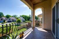 This patio off one of the upstairs bedrooms faces east, making a wonderful spot for a morning read and coffee!