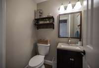 The half bath is conveniently located downstairs between the salon and main living area.
