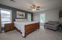 Plenty of natural light in this large primary bedroom.