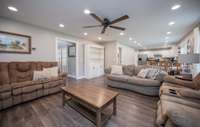 Open concept living, dining and kitchen area.