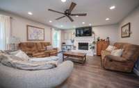 Lovely gas fireplace anchors the spacious living room.