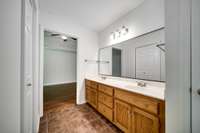 The master bath includes a double vanity with his-and-hers sinks.