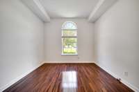 Bedroom #1 also has a stunning arched window that fills the room with natural light.