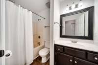 Full Bath #1 offers a tub/shower combo, vanity with storage, and a clean, functional layout.