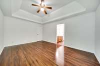 The spacious master bedroom easily fits a king-size bed along with a full bedroom furniture set.