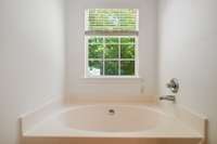 Unwind in the extra-large soaking tub, ideal for relaxing after a long day.