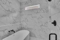 Enjoy a soak in the roomy tub, or enjoy the steam in this wet room! Poplar Plan - Photos depict builders' quality, this model will differ.