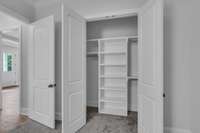 XL closets with shelving for easy organization. Poplar Plan - Photos depict builders' quality, this model will differ.