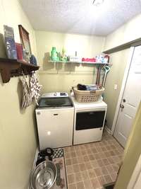 Utility room looking from kitchen towards back door.