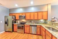 Kitchen has all stainless appliances and granite counter tops.