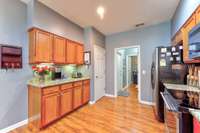 Additional cabinets and counter space, perfect for a coffee bar.