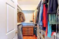 Spacious walk in closet in master bedroom.