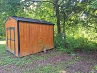 extra electric meter behind storage building