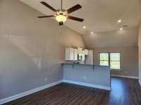 Living Room and Kitchen are Open and have a Vaulted Ceiling.  Picture of Similar House.