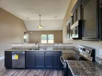 Vaulted Ceiling in Open Living Room and Kitchen/Dining Room. Picture of Previous House.