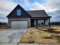 Lot 98 Valley Farms is under construction.  Great House Plan with Primary Bedroom on Main Level. Picture of Similar House.