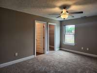Large Primary Bedroom with Walk-In Closet.  Picture of Previous House.