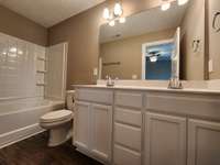 Primary Bedroom has Custom Cabinet and 2 Sinks.  Picture of Previous House.